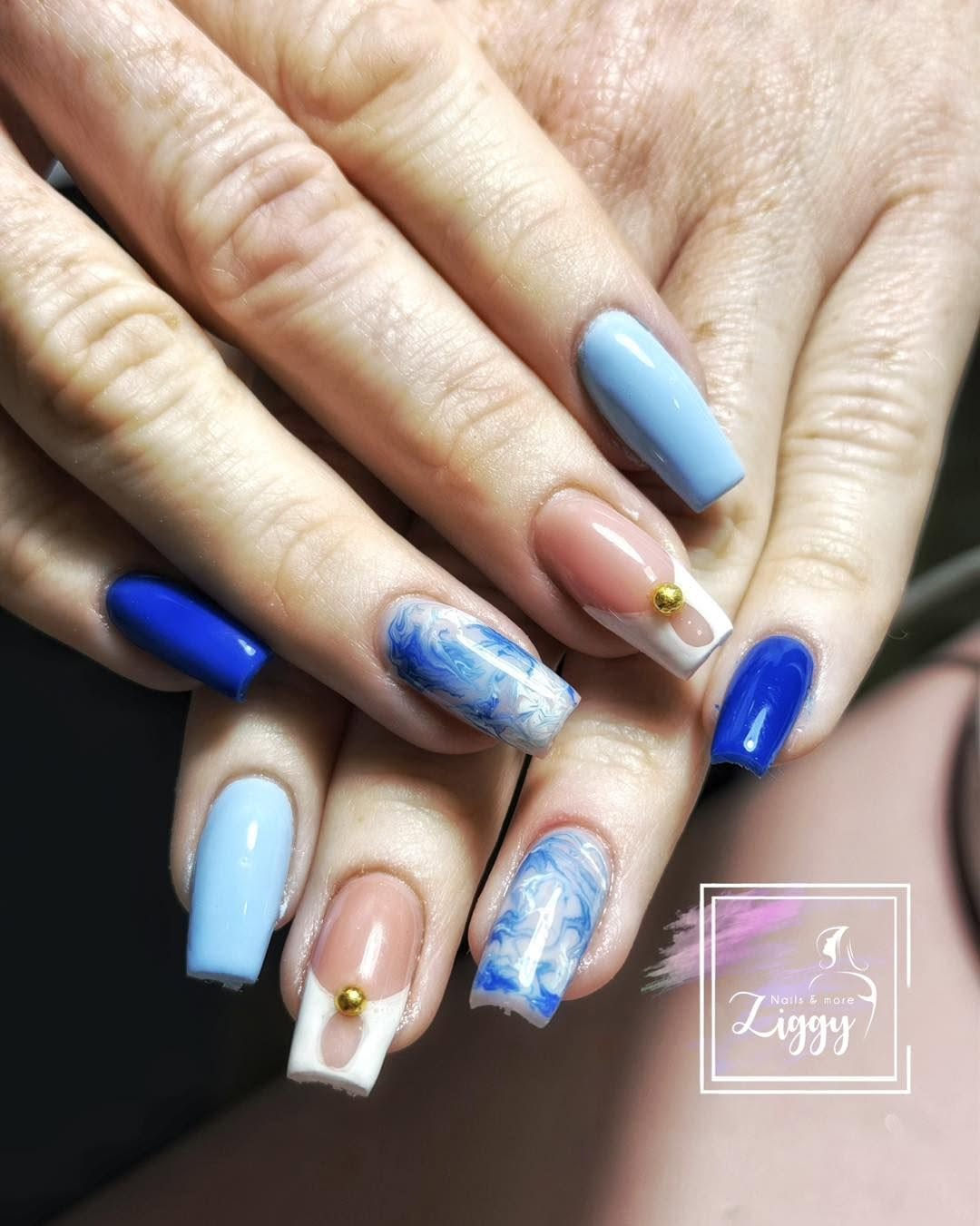 Ocean blue marble nail design with gold accents